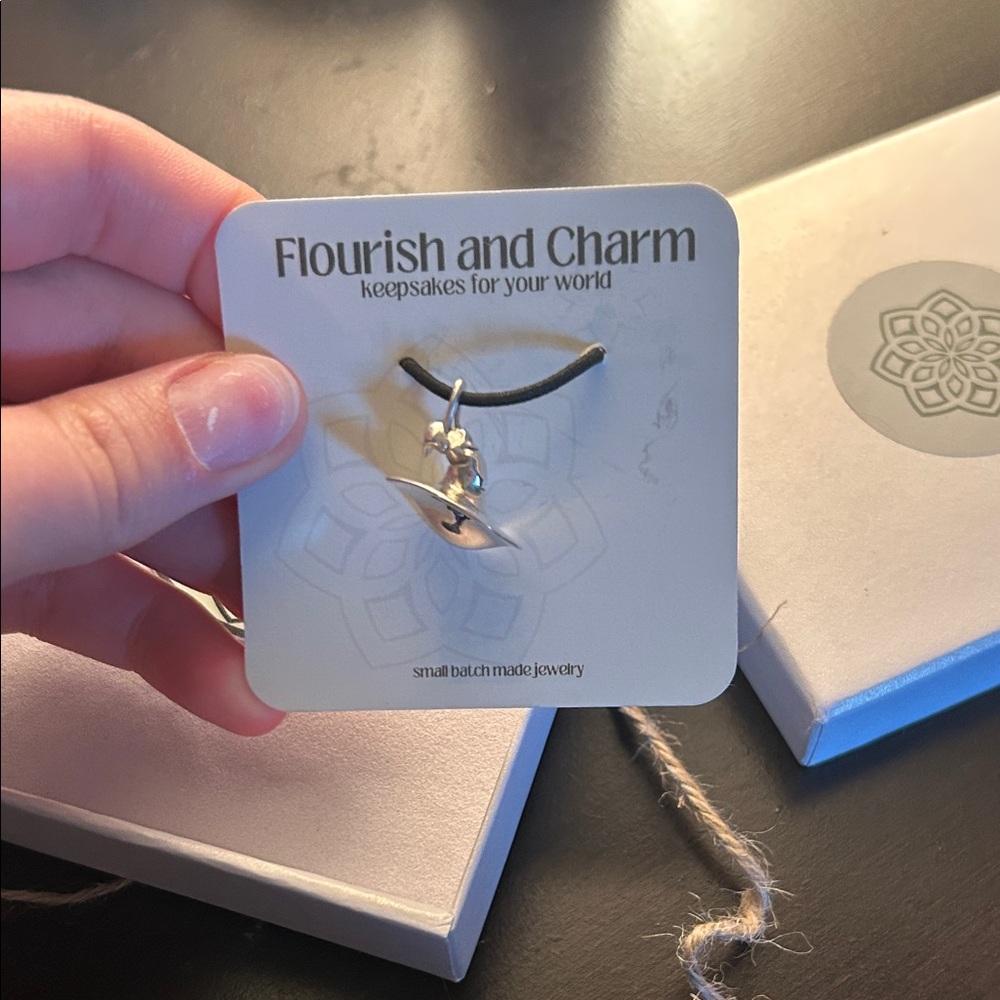 Flourish and charm with hat pendant